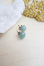 Load image into Gallery viewer, 8mm Sea Green Aventurine on surgical steel posts sitting on a table