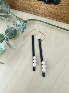 Black and gold pearl stick earrings