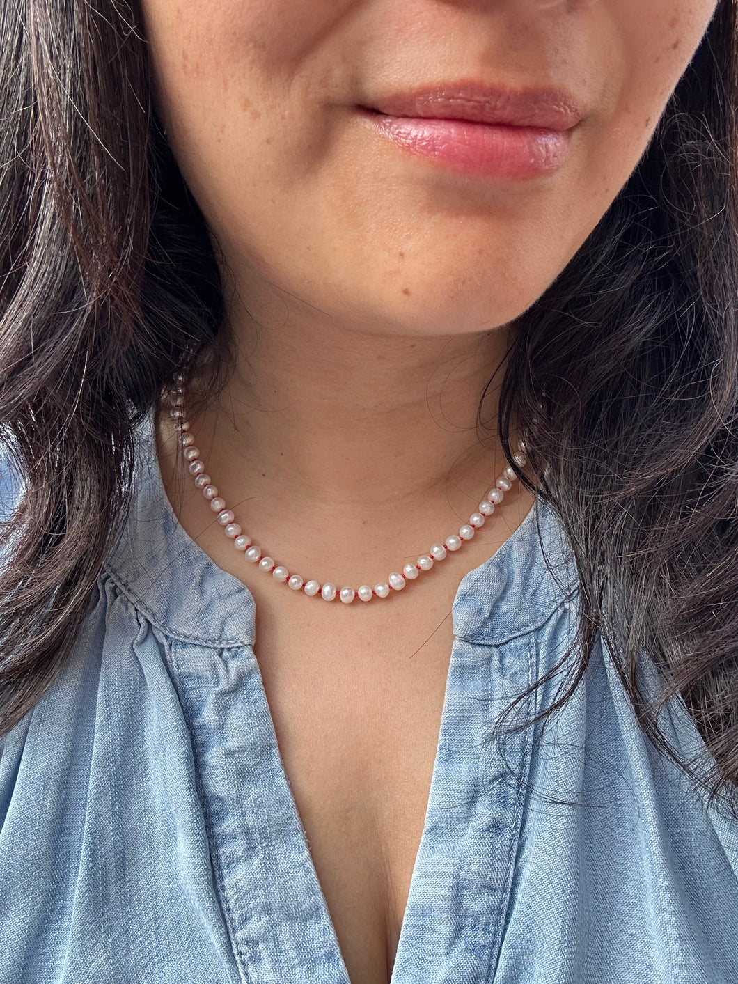 Handknotted White Pearl strand with Red Silk