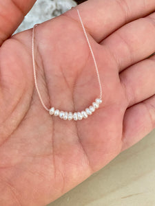 White Pearl Bar on a Silk Cord