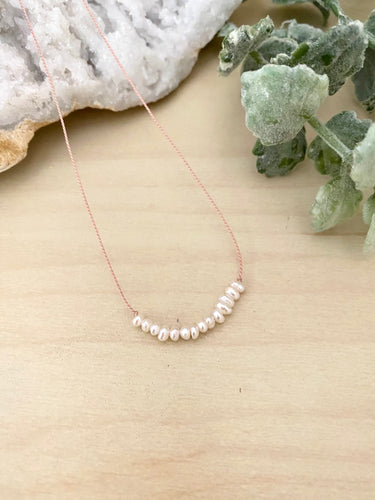 White Pearl Bar on a Silk Cord