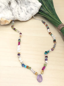 Bright Multi color gemstone necklace with a light purple amethyst focal drop