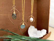 Load image into Gallery viewer, A group of gold gemstone necklaces with a handmade hammered wish bone shaped pendant enclosing a gemstone or freshwater pearl drop.  