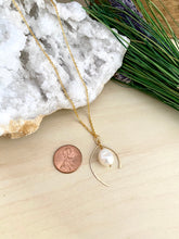 Load image into Gallery viewer, wish bone shaped gold metal frame with a freshwater pearl enclosed within in pendant frame.  